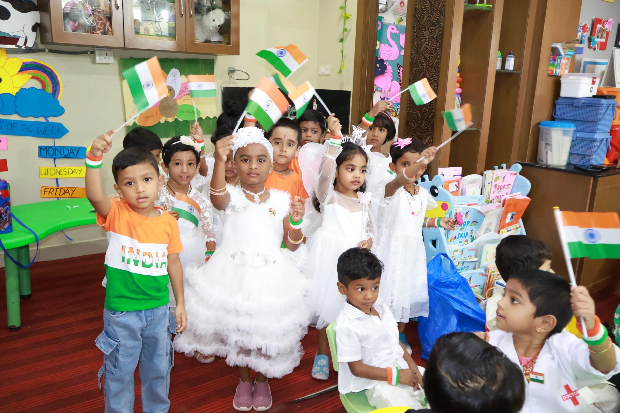 Happy preschool children and teachers in a classroom